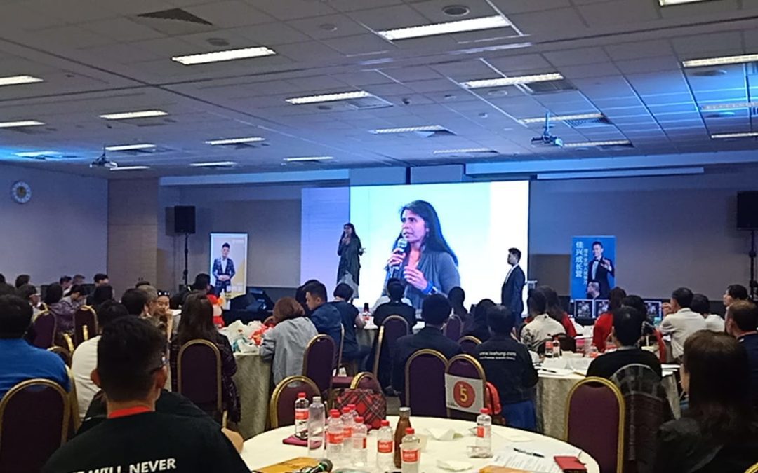 Person sitting quietly at sunset reflecting on personal growth influenced by parents